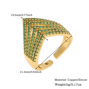 Detail of V-shaped gold ring with green zircons showing dimensions 19.5mm and material copper