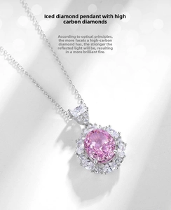 Macro view of ice flower cut pink carbon diamond pendant with S925 silver halo setting