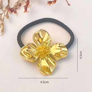 Golden flower alloy hair tie with black elastic band, 4.5cm floral ornament detail
