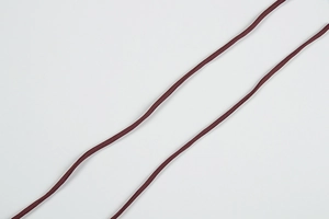 Detail of dark reddish-brown woven cords for DIY jewelry and garment accessories