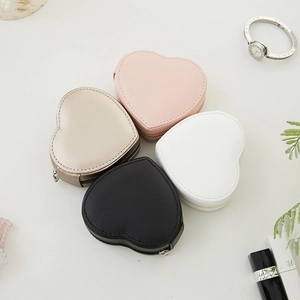 Heart-shaped PU leather jewelry travel cases in pink, gold, white, and black colors
