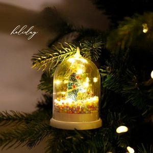 Luminous Christmas tree ornament with LED lights and snow scene in a clear dome