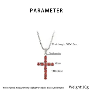Macro detail of stainless steel cross pendant with red cubic zirconia and dimensions