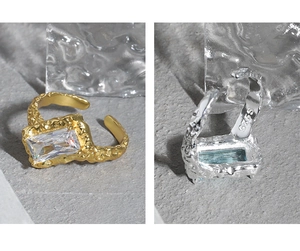Detail of S925 sterling silver ring with hammer texture and rectangular zircon stone