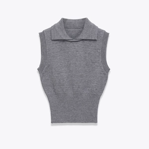 Detail of grey knitted polo vest featuring refined ribbed waist and collar textures