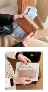 Detail of lychee textured leather coin purse with zipper and lanyard in stylish bicolor