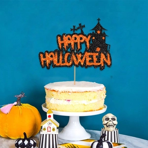Sparkly Happy Halloween cake topper in orange and black glitter on a two-tier cake