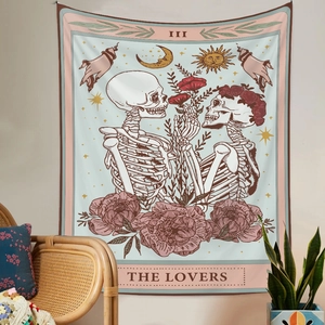 Detail of The Lovers tarot tapestry showing skull design in a cozy bohemian room setting