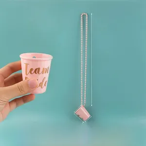 Pink Team Bride beaded shot glass necklace with golden lettering and size dimensions