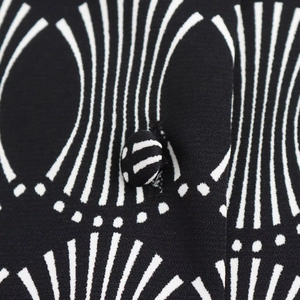 Women's A-line blouse with geometric print, collared neck, and matching button detail