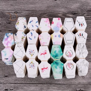 Colorful paper jewelry display cards with floral and marble patterns for necklaces