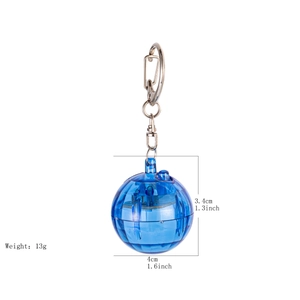 Detail view of blue transparent glowing ball keychain showing 3.4cm by 4cm dimensions