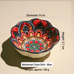 Detail view of 9cm ceramic sauce dish with blue mandala pattern and wavy edges