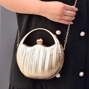 Elegant gold crescent evening clutch bag with metallic texture and a delicate chain strap