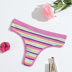 Detailed view of colorful ribbed cotton thong featuring soft pink edges and floral props