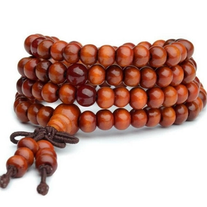 Detailed view of 8mm sandalwood beads with traditional Chinese knot and tassel