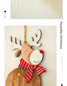 Detail of wooden Christmas elk ornament with natural texture and red striped scarf