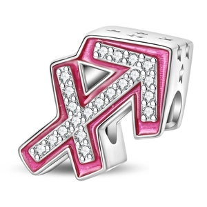 Macro shot of silver Sagittarius charm with pink enamel, star cutouts, and zircon stones
