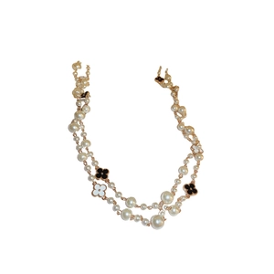 Double-layer pearl flower necklace with black and white clover charms in gold finish