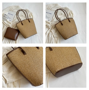Detail view of woven beach bag showing brown leather handles and inner zipper pouch