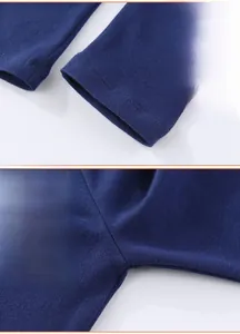 Detail view of reinforced stitching and hem finish on navy blue knitted cotton leggings