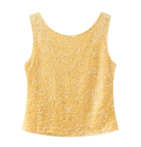 Detailed close-up of shiny gold sequins on a sleeveless top with high-quality texture