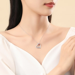 S925 silver heart necklace for Mom with a red gemstone pendant on a female model
