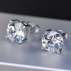 Classic four-prong round zircon stud earrings with silver plating and brilliant fire