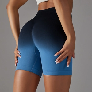 Rear view of seamless high-waist fitness shorts with black to blue gradient effect