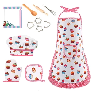 Kids baking set with pink cupcake apron, chef hat, and miniature kitchen tools on white