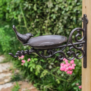 European vintage cast iron wall-mounted bird feeder with scrollwork for garden decor
