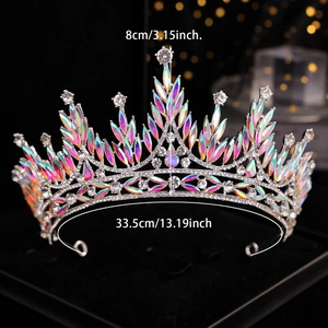 Silver bridal crown with iridescent rhinestones featuring leaf motifs on black stand