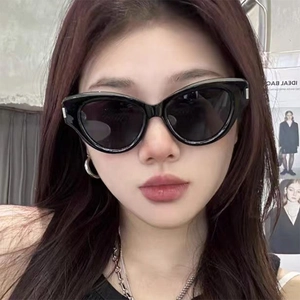 Classic black cat-eye sunglasses for women with wide frames and silver metal accents