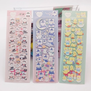Three sheets of cute cartoon bear and duck stickers in pink, purple, and green colors