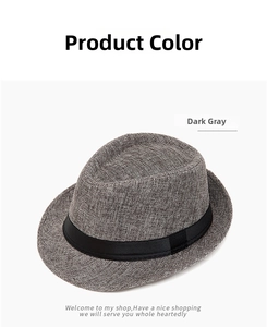 Detail view of deep gray straw fedora hat featuring a classic black ribbon band