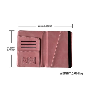 Pink PU leather passport holder detail with SIM slots and elastic closure band