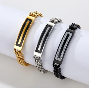 Detailed view of Cuban link bracelets in gold, silver, and black with carbon fiber inlays