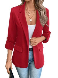 Detailed close-up of a red long-sleeved blazer jacket featuring a formal lapel collar design