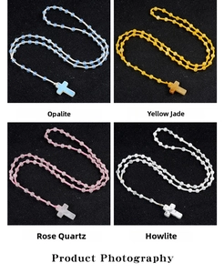 Detail showing cross necklaces in Opalite, Yellow Jade, Rose Quartz and Howlite stones