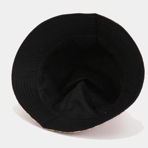 Floral reversible bucket hat featuring a black inner lining and wide protective sun brim