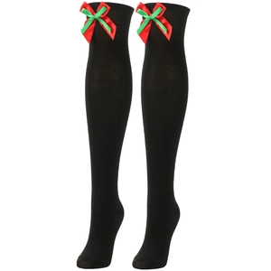 Detail of black Christmas over-knee socks featuring red and green ribbon bows and knit texture