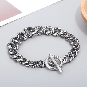 Detailed view of silver stainless steel Cuban chain with OT toggle clasp and rope texture