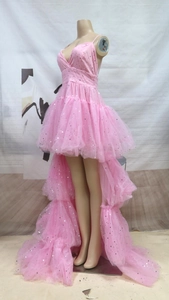 Detail of pink star sequins and multi-layer tulle on a high-low hem wedding gown