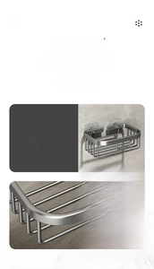 Detail of wall-mounted metal shelf showing grid drainage design and adhesive hooks