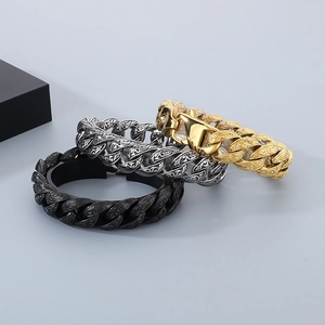 Detail of 18mm Cuban bracelets in black, silver and gold with retro engraved textures