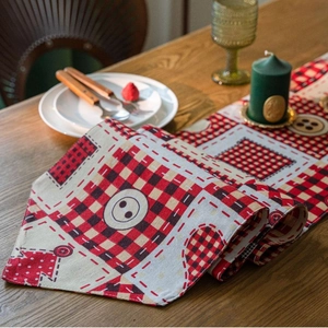 Rustic Christmas plaid table runner with heart patchwork on wooden dining table