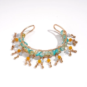 Bohemian beaded C-shape cuff bracelet with gold wire wrap and blue glass tassels