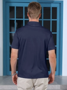Rear view of a navy blue men's polo shirt featuring a tailored fit and classic collar