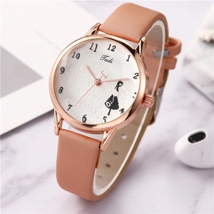 Fashionable peach leather strap quartz watch with rose gold case on marble backdrop