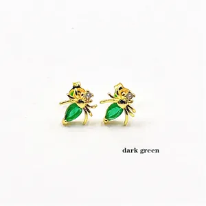 Golden spider stud earrings with dark green marquise-cut zircon in vintage style